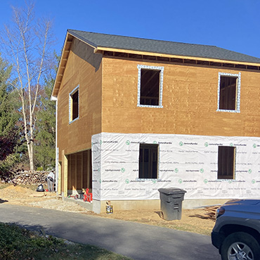 Photo of a two story building under construction